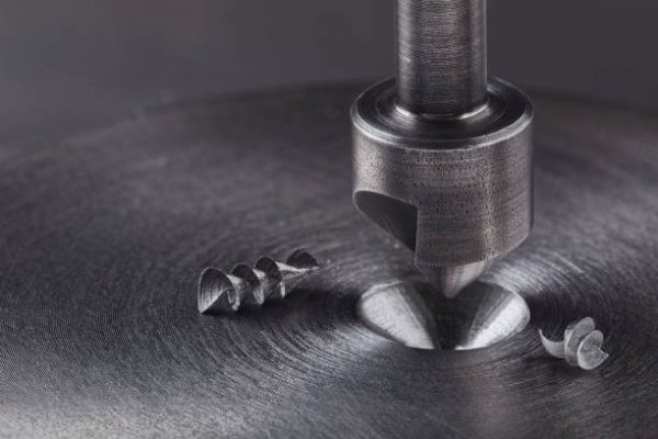 Countersink drill bit make sink in hole in steel billet. Locksmith work.